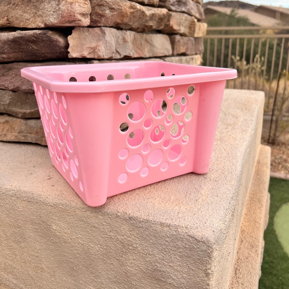 Pink plastic storage basket 6” height x 8 3/4” width x 7 1/2” length